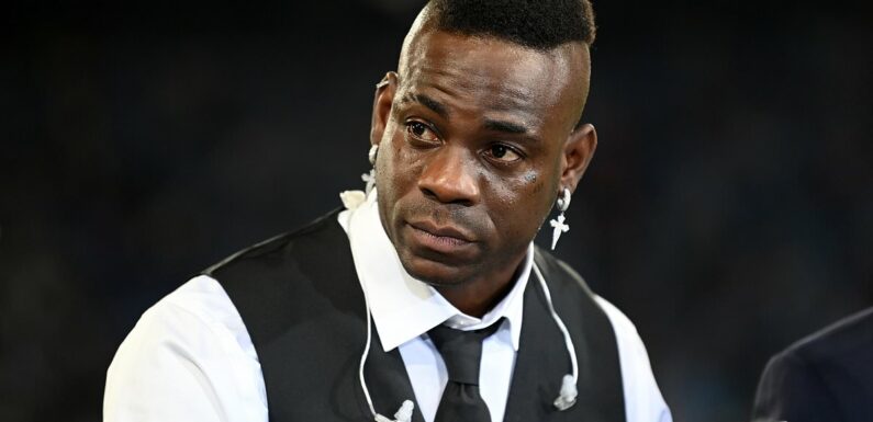 Balotelli is helped to an ambulance after crashing his £100,000 Audi