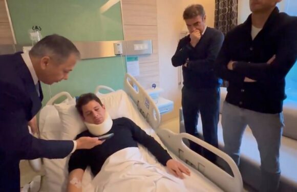 Ref battered on pitch by club president pictured in hospital with neck brace